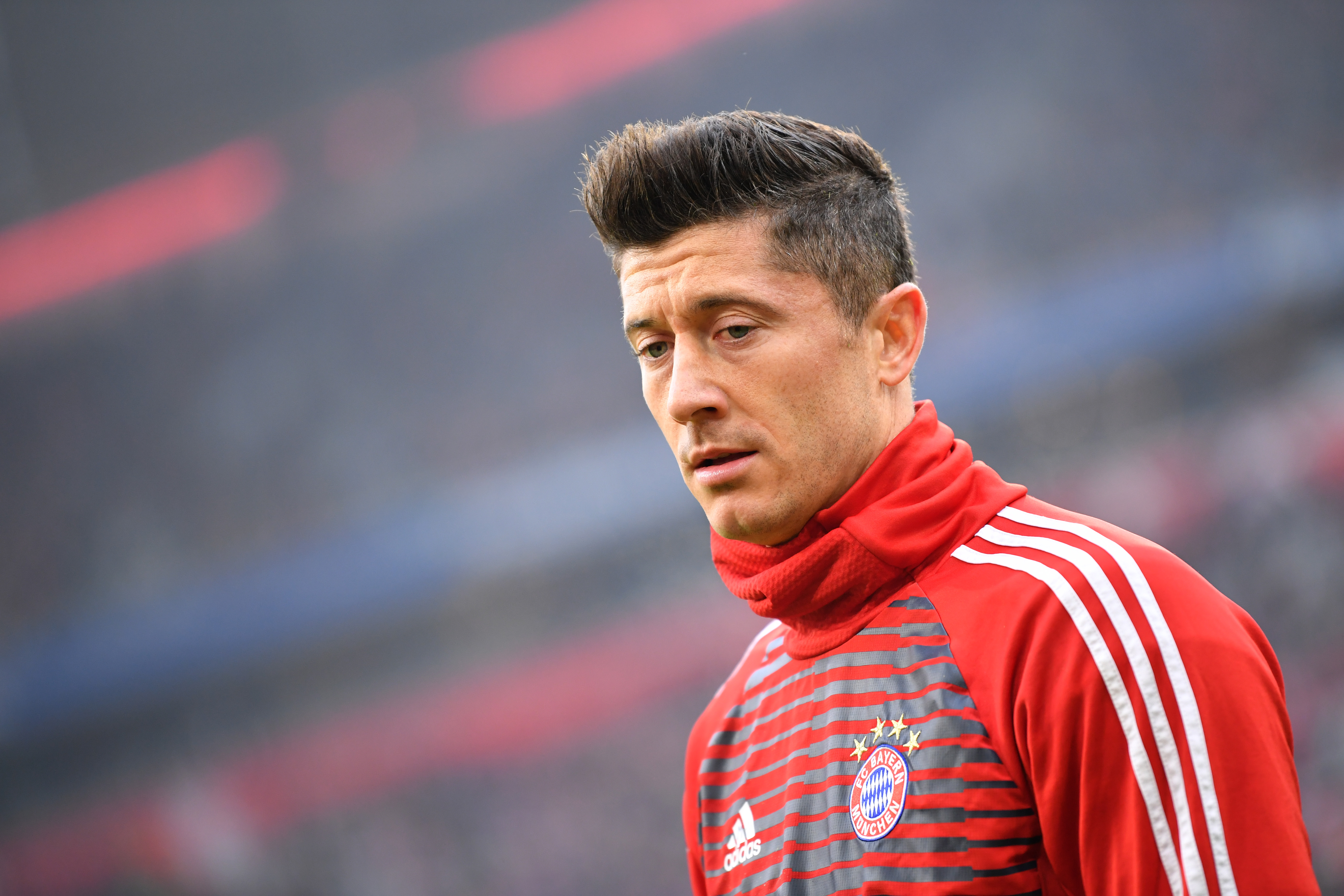 MUNICH, GERMANY - JANUARY 27: Robert Lewandowski of Muenchen looks on prior to the Bundesliga match between FC Bayern Muenchen and TSG 1899 Hoffenheim at Allianz Arena on January 27, 2018 in Munich, Germany. (Photo by Sebastian Widmann/Bongarts/Getty Images)