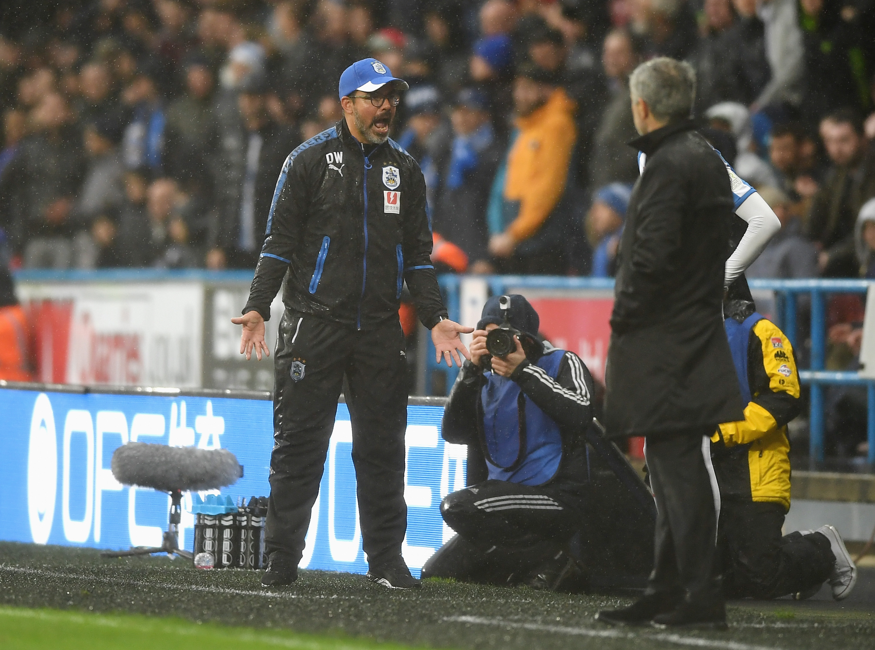 HUDDERSFIELD, ENGLAND - OCTOBER 21: David Wagner, Manager of Huddersfield Town reacts as Jose Mourinho, Manager of Manchester United looks on during the Premier League match between Huddersfield Town and Manchester United at John Smith's Stadium on October 21, 2017 in Huddersfield, England. (Photo by Gareth Copley/Getty Images)