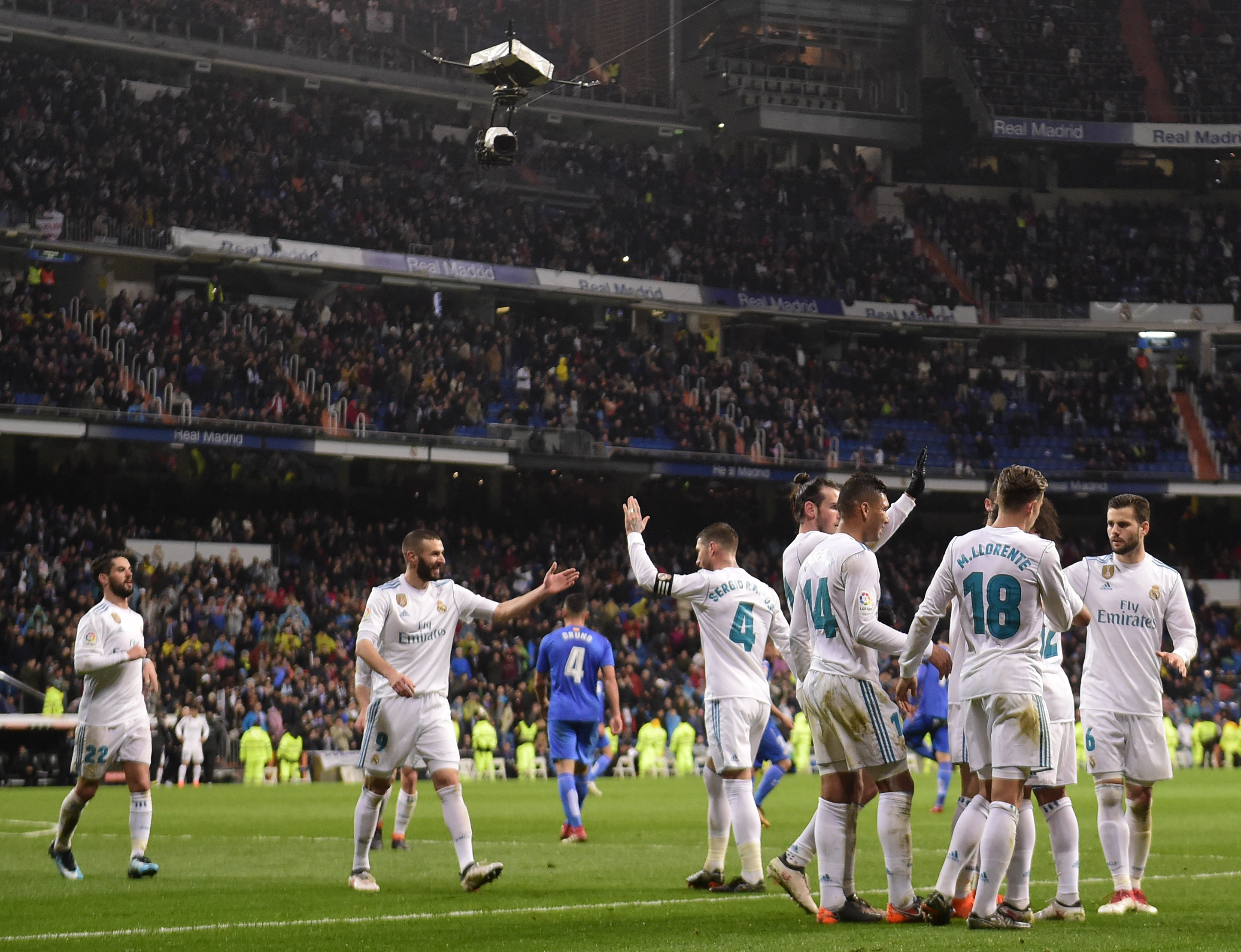 Real Madrid players celebrate their third goal during the Spanish league football match Real Madrid CF against Getafe CF at the Santiago Bernabeu stadium in Madrid on March 3, 2018. / AFP PHOTO / PIERRE-PHILIPPE MARCOU (Photo credit should read PIERRE-PHILIPPE MARCOU/AFP/Getty Images)