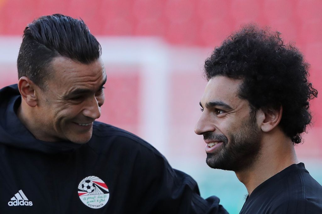 Egypt's goalkeeper Essam El Hadary speaks with Egypt's forward Mohamed Salah (R) during a training session at the Akhmat Arena Stadium in Grozny on June 21, 2018 during the 2018 Russia World Cup football tournament. (Photo by KARIM JAAFAR / AFP) (Photo credit should read KARIM JAAFAR/AFP/Getty Images)