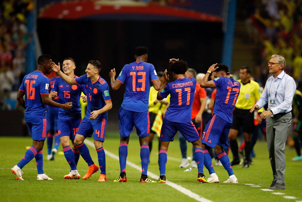 KAZAN, RUSSIA - JUNE 24: Juan Cuadrado of Colombia celebrates after scoring his team's third goal with his team mates during the 2018 FIFA World Cup Russia group H match between Poland and Colombia at Kazan Arena on June 24, 2018 in Kazan, Russia. (Photo by Julian Finney/Getty Images)