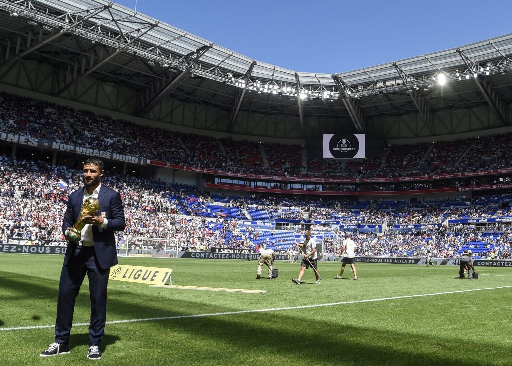 yon's French midfielder Nabil Fekir presents the World cup trophy to fans before the French L1 football match between Lyon and Amiens on August 12 , 2018, in Decines-Charpieu near Lyon, central-eastern France. (Photo by PHILIPPE DESMAZES / AFP) (Photo credit should read PHILIPPE DESMAZES/AFP/Getty Images)