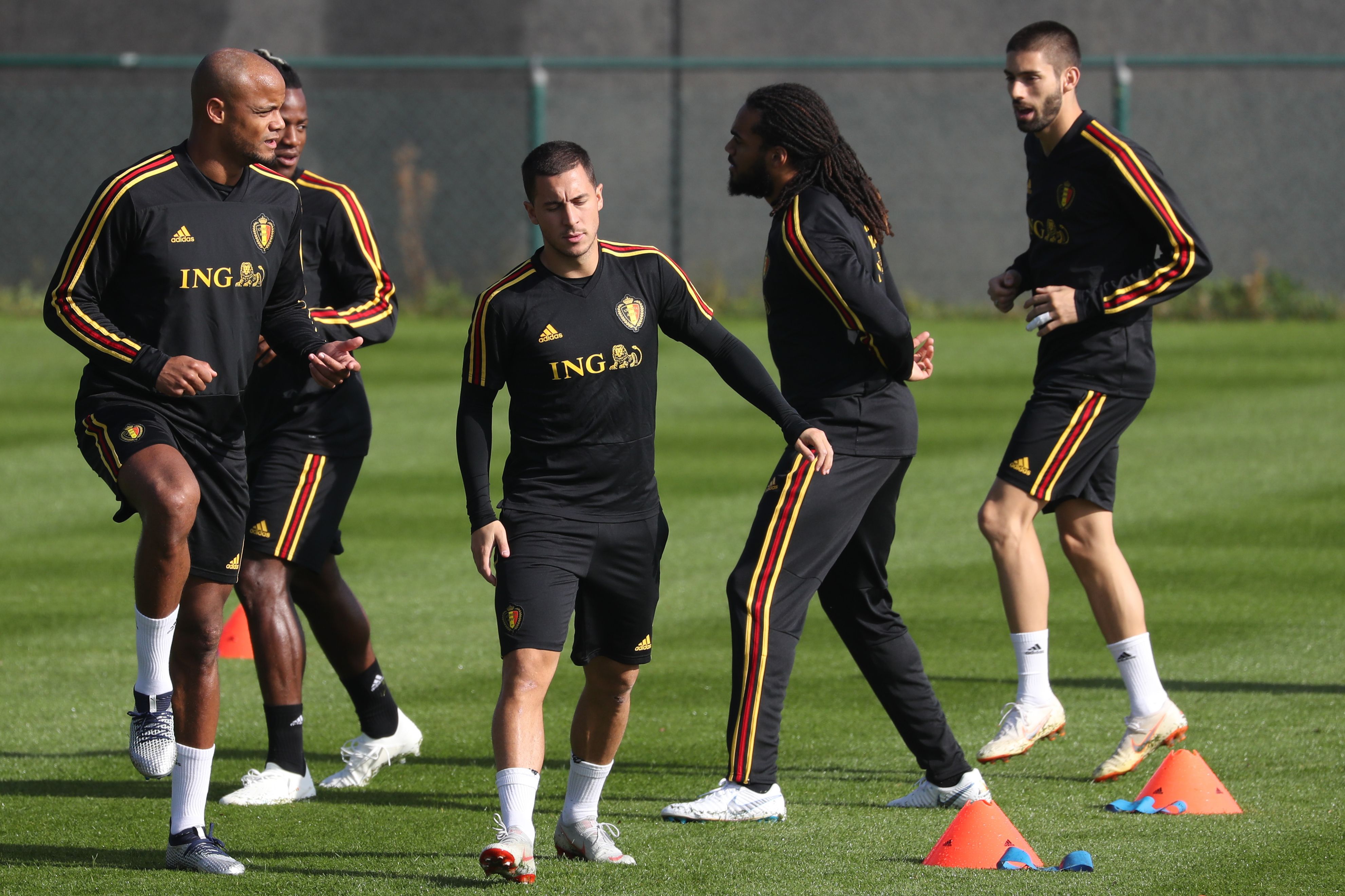 Belgium's players Vincent Kompany (L) and Eden Hazard (3rdL) take part in a training session of Belgian football national team the Red Devils in Tubize, on October 9, 2018, ahead the upcoming Nations League football match against Switzerland. (Photo by VIRGINIE LEFOUR / BELGA / AFP) / Belgium OUT        (Photo credit should read VIRGINIE LEFOUR/AFP/Getty Images)