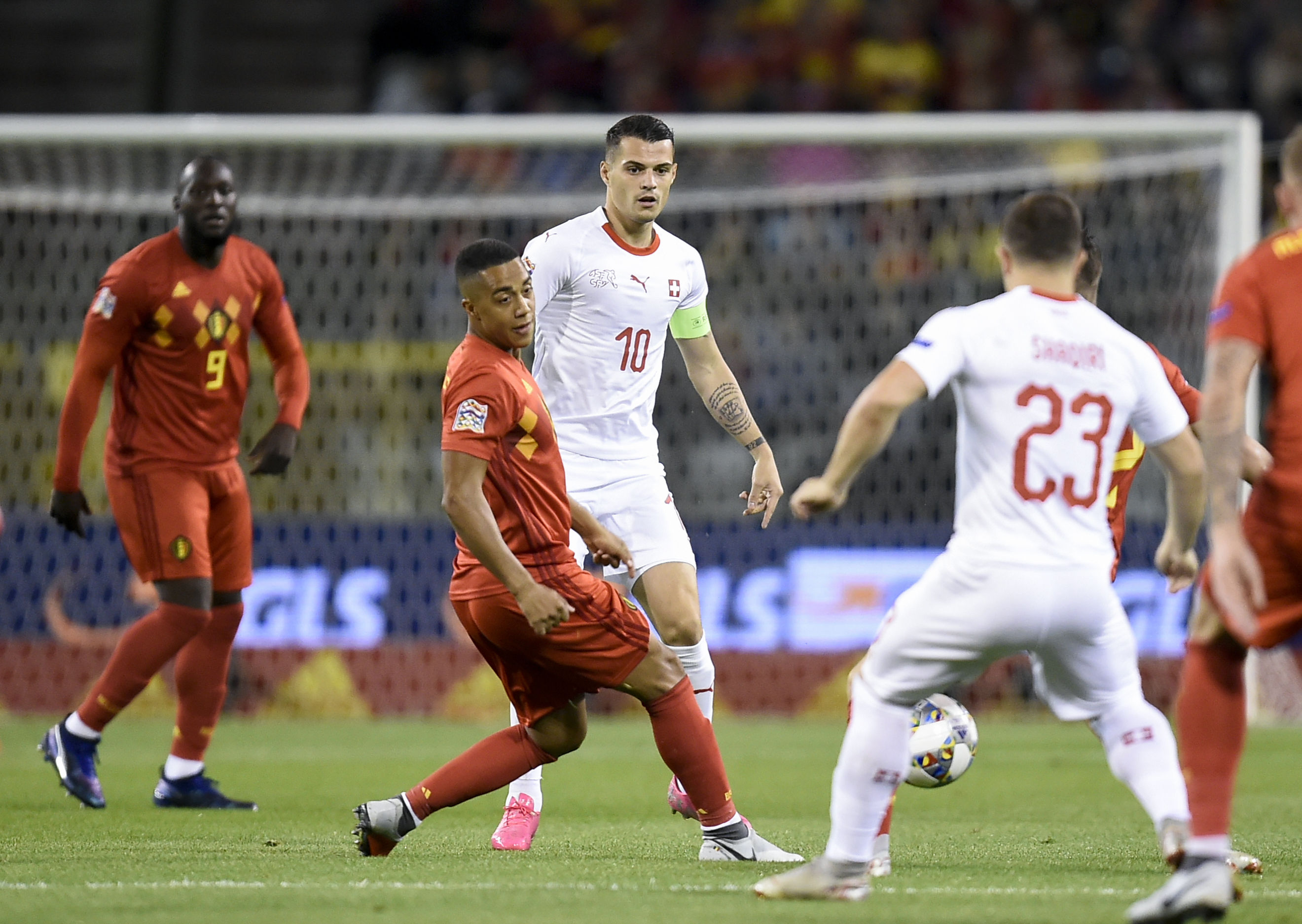 Belgium's midfielder Youri Tielemans (C-L) vies with Switzerland's Xherdan Shaqiri (C-R) during the UEFA Nations League football match between Belgium and Switzerland, at the King Baudouin Stadium, in Brussels, on October 12, 2018. (Photo by JOHN THYS / AFP) (Photo credit should read JOHN THYS/AFP/Getty Images)