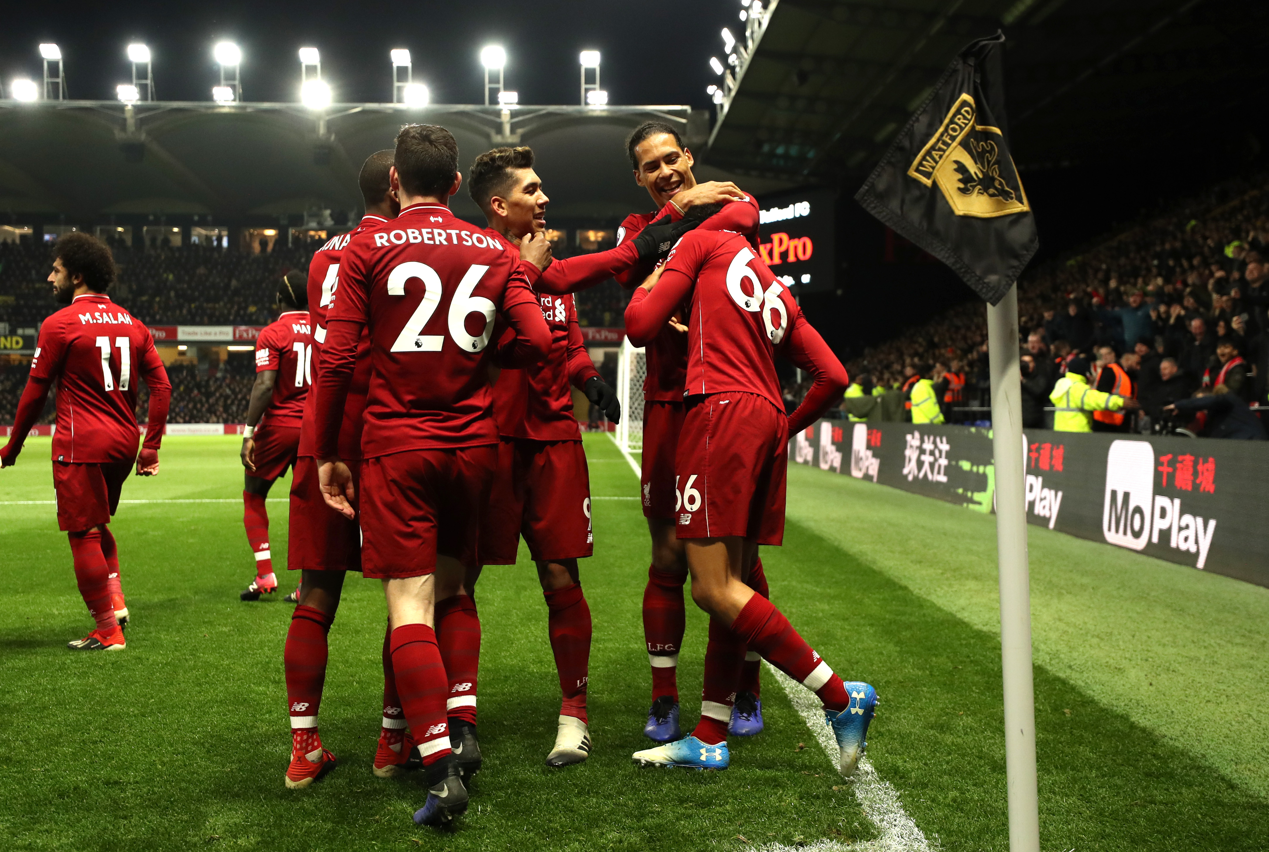 WATFORD, ENGLAND - NOVEMBER 24: Trent Alexander-Arnold of Liverpool celebrates with teammates after scoring his team's second goal during the Premier League match between Watford FC and Liverpool FC at Vicarage Road on November 24, 2018 in Watford, United Kingdom. (Photo by Richard Heathcote/Getty Images)