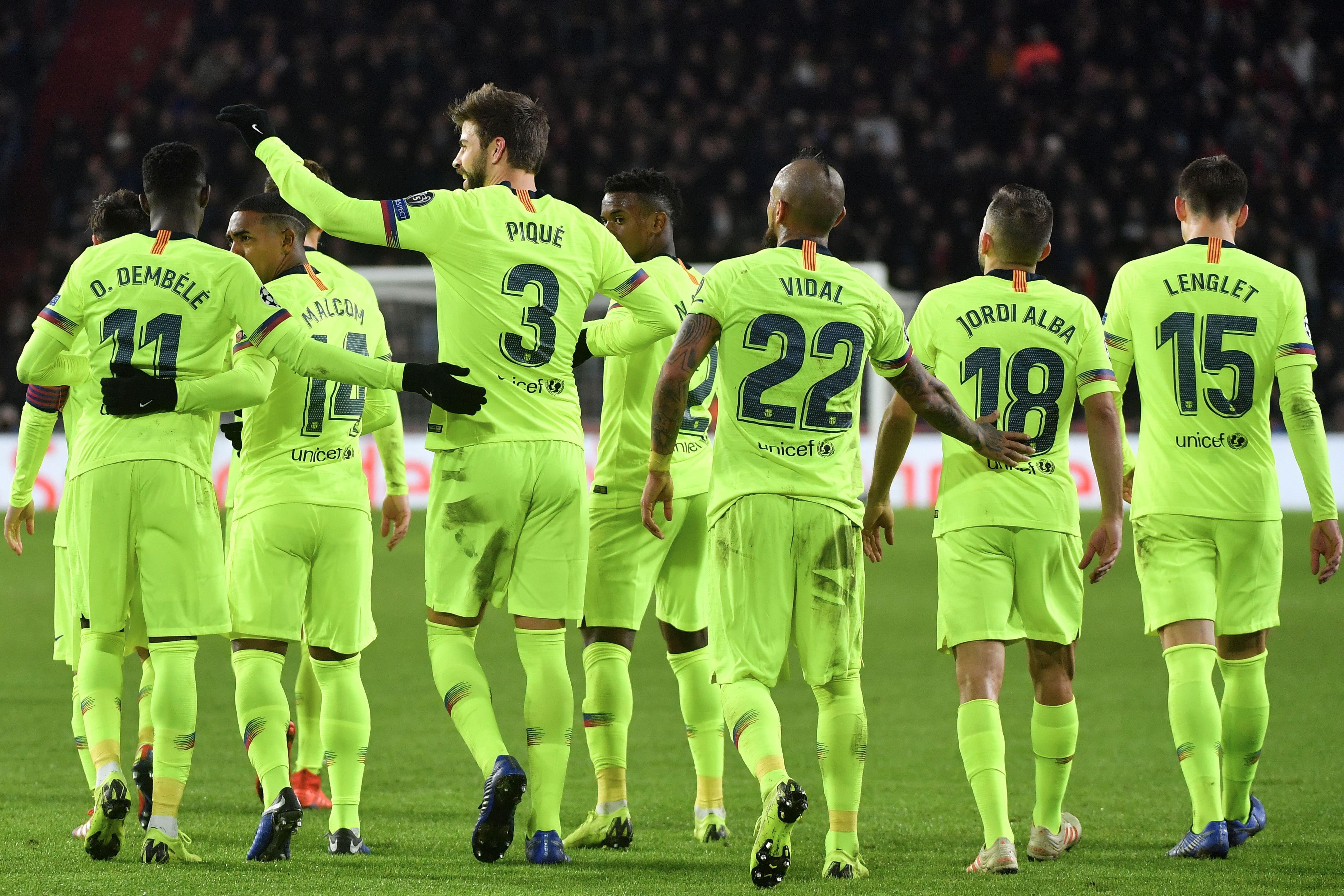 Barcelona's Spanish defender Gerard Pique (3rdL) celebrates with his teammates after scoring during the UEFA Champions League football match between PSV Eindhoven and FC Barcelona at Philips stadium in Eindhoven on November 28, 2018. (Photo by EMMANUEL DUNAND / AFP) (Photo credit should read EMMANUEL DUNAND/AFP/Getty Images)