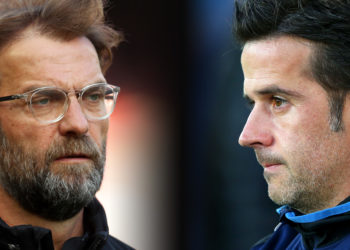FILE PHOTO (EDITORS NOTE: COMPOSITE OF IMAGES - Image numbers 946221366,1025073120 - GRADIENT ADDED) In this composite image a comparison has been made between Jurgen Klopp, Manager of Liverpool (L) and  Marco Silva, Manager of Everton.  Liverpool FC and  Everton FC  meet in the Merseyside derby at Anfield on December 2, 2018 in Liverpool.  ***LEFT IMAGE***  LIVERPOOL, ENGLAND - APRIL 14: Jurgen Klopp, Manager of Liverpool looks on during the warm up prior to the Premier League match between Liverpool and AFC Bournemouth at Anfield on April 14, 2018 in Liverpool, England. (Photo by Clive Brunskill/Getty Images) ***RIGHT IMAGE***  LIVERPOOL, ENGLAND - AUGUST 29: Marco Silva, Manager of Everton looks on prior to the Carabao Cup Second Round match between Everton and Rotherham United at Goodison Park on August 29, 2018 in Liverpool, England. (Photo by Alex Livesey/Getty Images)