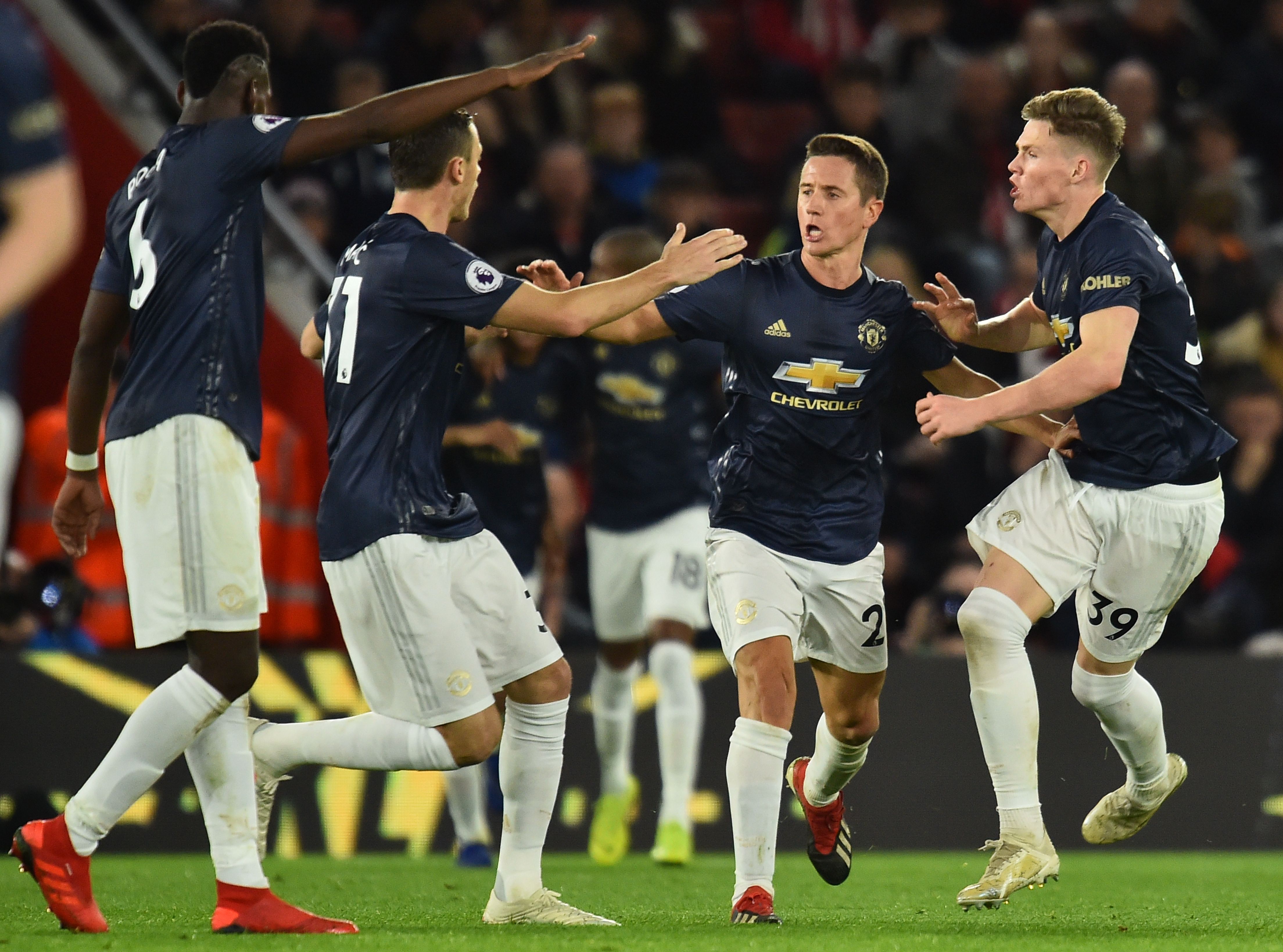 Manchester United's Spanish midfielder Ander Herrera (2R) celebrates scoring their second goal to equalise 2-2 during the English Premier League football match between Southampton and Manchester United at St Mary's Stadium in Southampton, southern England on December 1, 2018. (Photo by Glyn KIRK / AFP) / RESTRICTED TO EDITORIAL USE. No use with unauthorized audio, video, data, fixture lists, club/league logos or 'live' services. Online in-match use limited to 120 images. An additional 40 images may be used in extra time. No video emulation. Social media in-match use limited to 120 images. An additional 40 images may be used in extra time. No use in betting publications, games or single club/league/player publications. / (Photo credit should read GLYN KIRK/AFP/Getty Images)