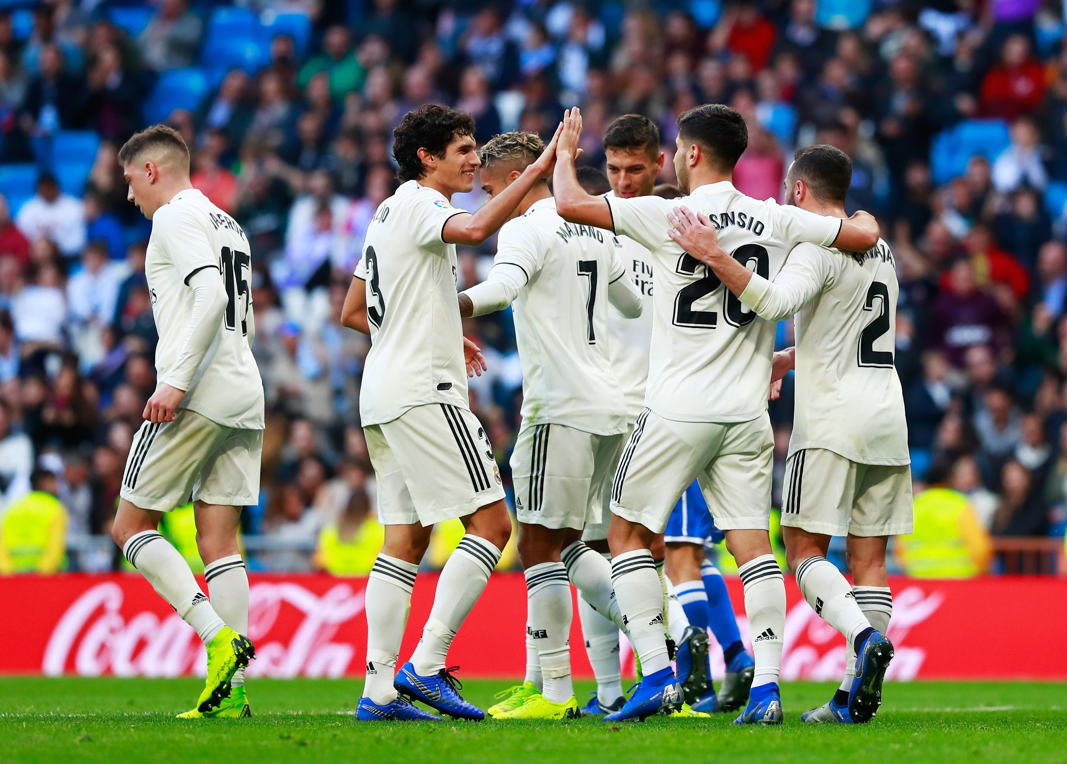 MADRID, SPAIN - DECEMBER 06:  Marco Asensio of Real Madrid (20) celebrates after scoring his team's second goal with team mates during the Copa del Rey fourth round match between Real Madrid and Melilla at Estadio Bernabeu on December 6, 2018 in Madrid, Spain.  (Photo by Gonzalo Arroyo Moreno/Getty Images)
