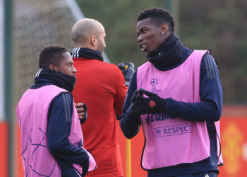 Manchester United's Brazilian midfielder Fred (L) and Manchester United's French midfielder Paul Pogba take part in a training session at the Carrington Training complex in Manchester, north west England on the eve of their Champions league group stage football match against Valencia on December 11, 2018. (Photo by Lindsey PARNABY / AFP)        (Photo credit should read LINDSEY PARNABY/AFP/Getty Images)