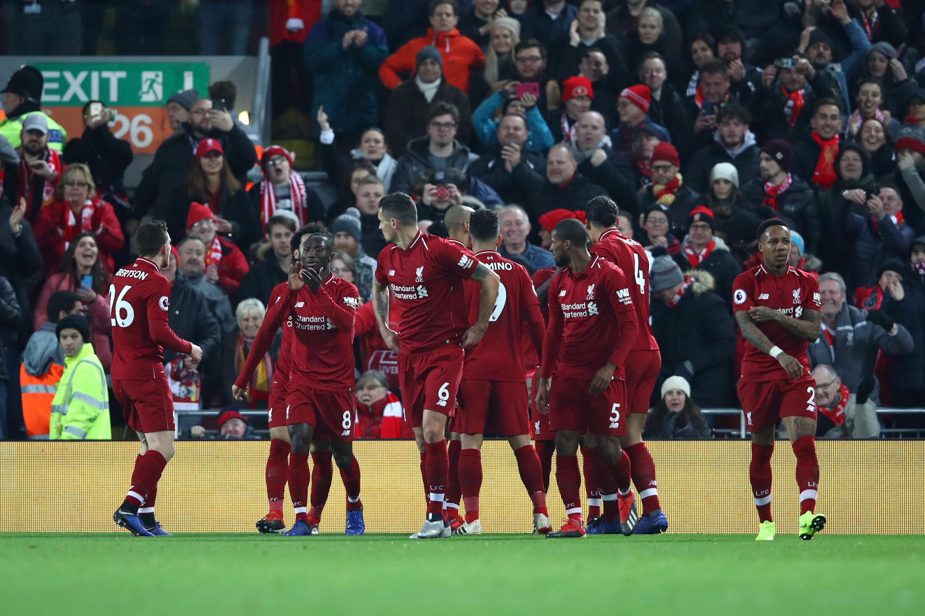 LIVERPOOL, ENGLAND - DECEMBER 16: Sadio Mane of Liverpool (hidden) celebrates with team mates after scoring his team's first goal during the Premier League match between Liverpool FC and Manchester United at Anfield on December 16, 2018 in Liverpool, United Kingdom. (Photo by Clive Brunskill/Getty Images)