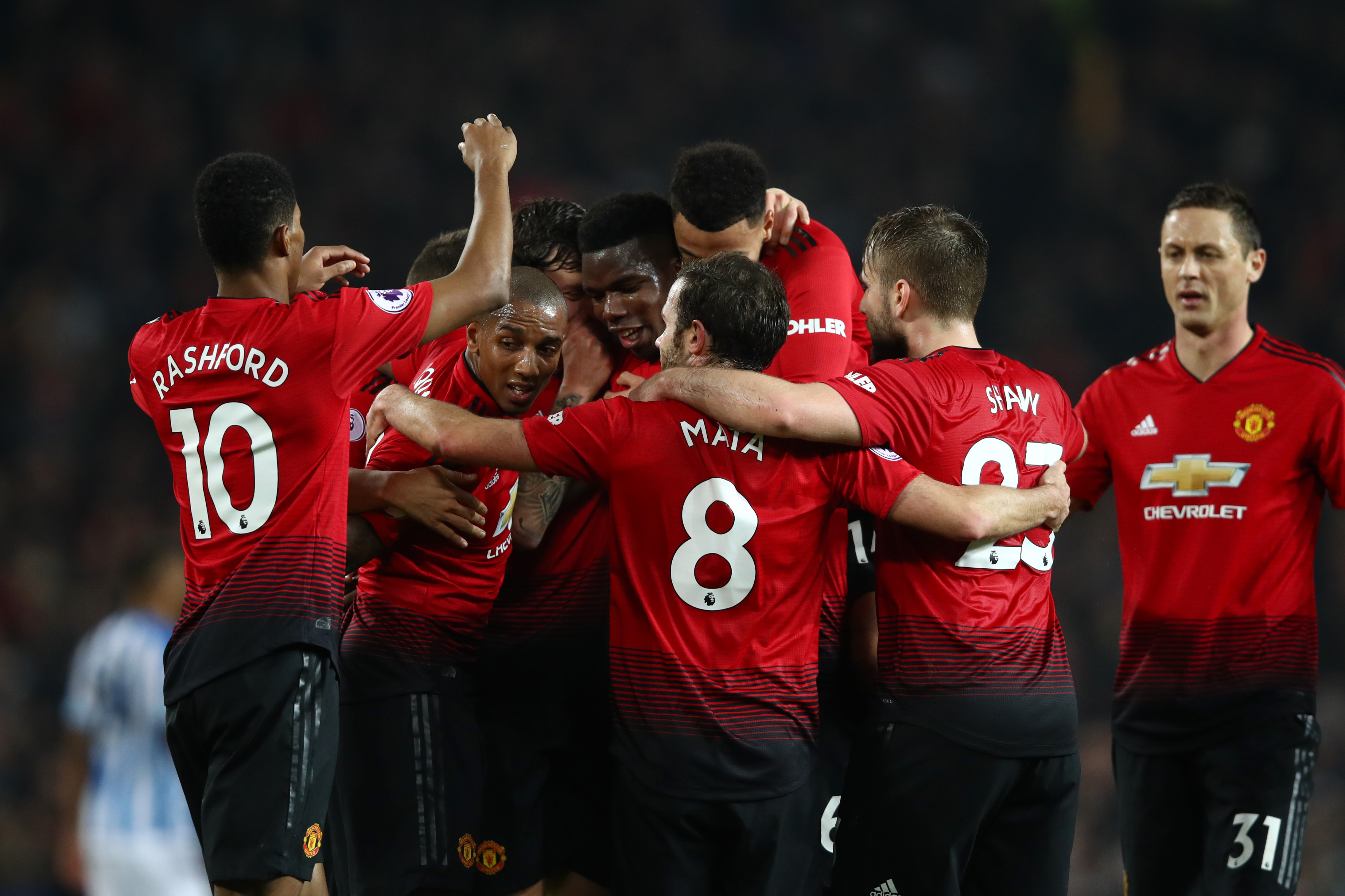 MANCHESTER, ENGLAND - DECEMBER 26: Paul Pogba of Manchester United celebrates with team mates after scoring their team's third goal during the Premier League match between Manchester United and Huddersfield Town at Old Trafford on December 26, 2018 in Manchester, United Kingdom. (Photo by Clive Brunskill/Getty Images)
