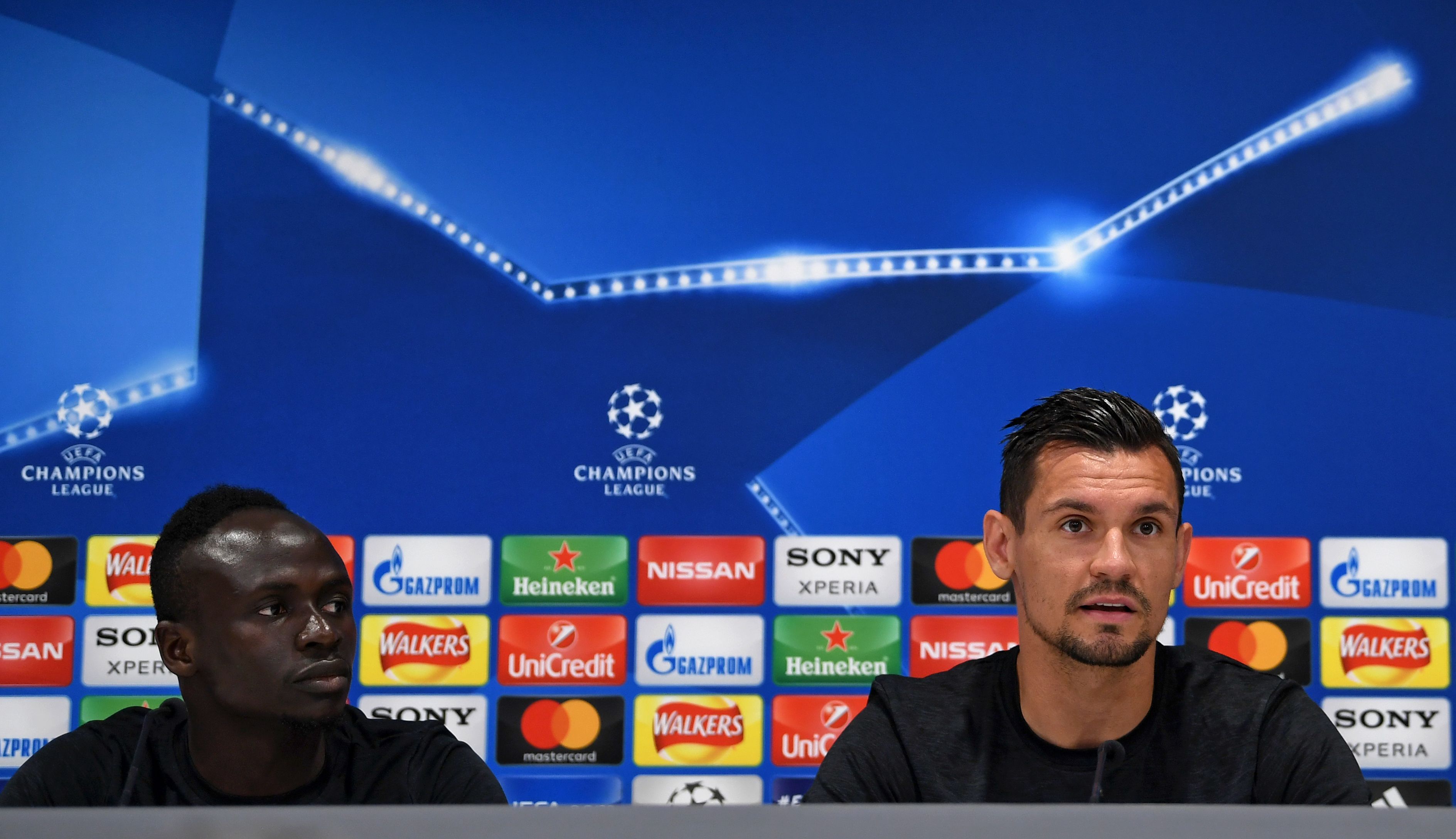 Liverpool's Senegalese midfielder Sadio Mane (L) and Liverpool's Croatian defender Dejan Lovren attends a press conference during a media day at Anfield stadium in Liverpool, north west England on May 21, 2018, ahead of their UEFA Champions League final football match against Real Madrid in Kiev on May 26. (Photo by Paul ELLIS / AFP) (Photo credit should read PAUL ELLIS/AFP/Getty Images)