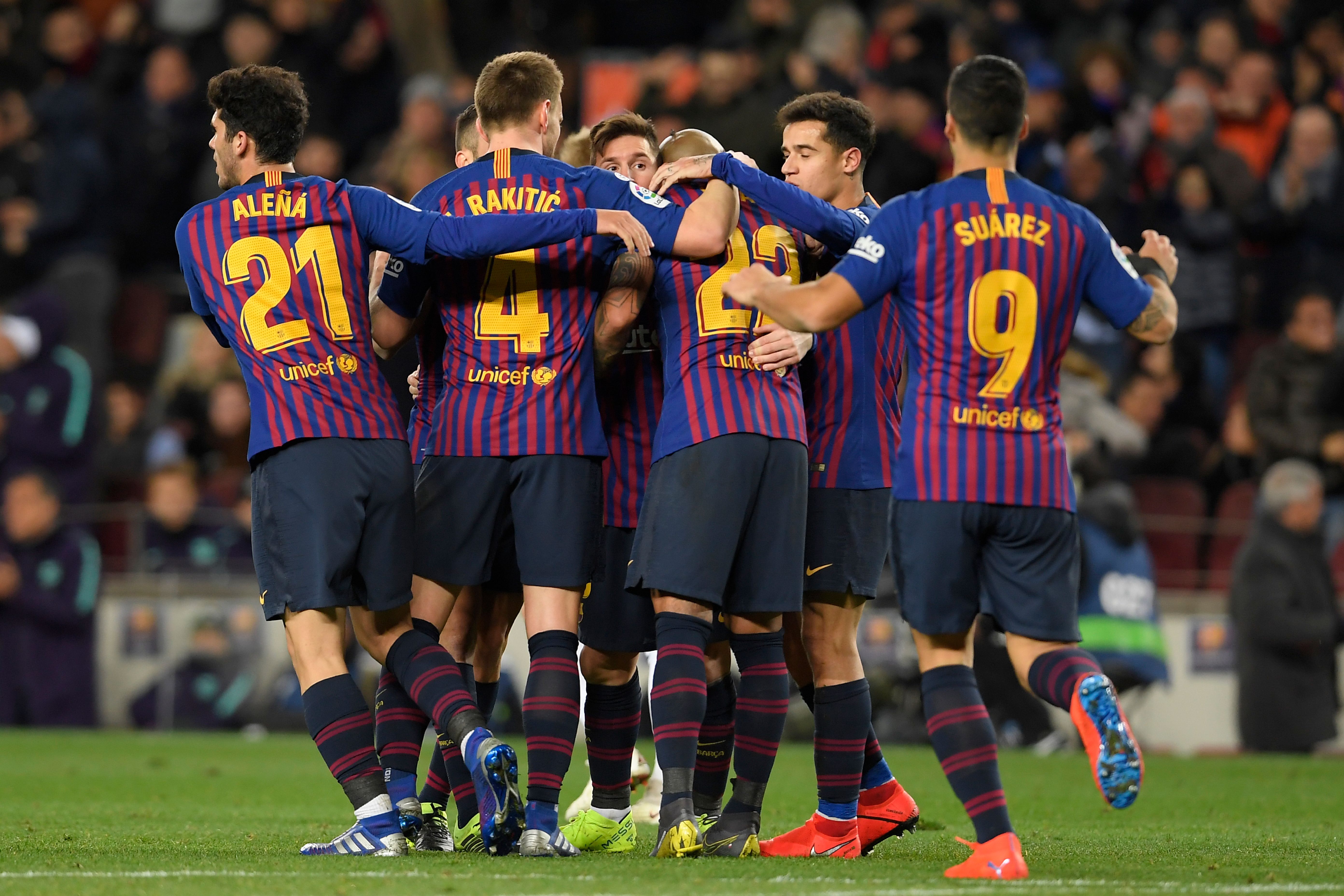 Barcelona's Argentinian forward Lionel Messi (C) celebrates with teammates after scoring during the Spanish league football match FC Barcelona against Valencia CF at the Camp Nou stadium in Barcelona on February 2, 2019. (Photo by LLUIS GENE / AFP) (Photo credit should read LLUIS GENE/AFP/Getty Images)
