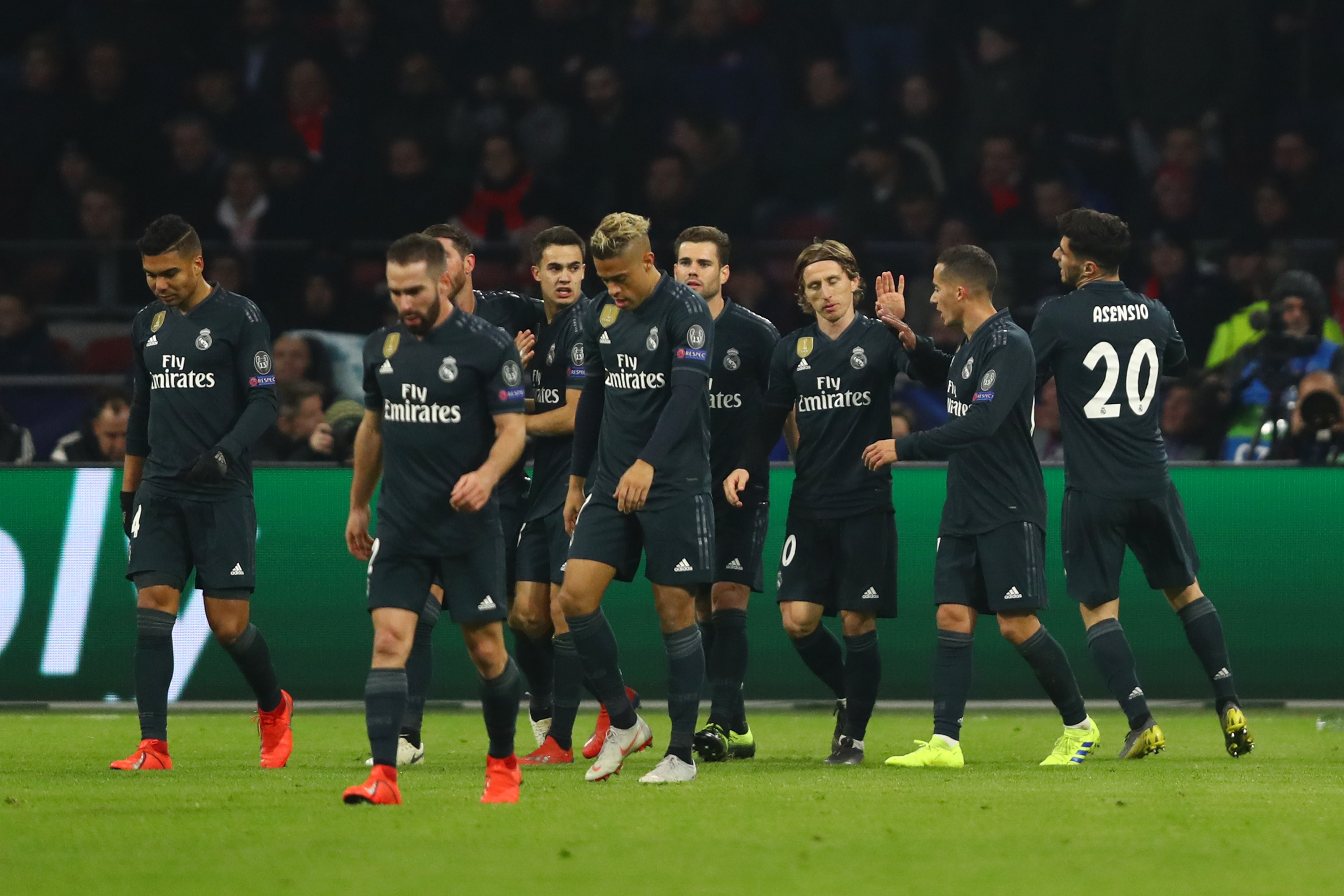 AMSTERDAM, NETHERLANDS - FEBRUARY 13: Marco Asensio of Real Madrid celebrates after scoring his team's second goal with his team mates during the UEFA Champions League Round of 16 First Leg match between Ajax and Real Madrid at Johan Cruyff Arena on February 13, 2019 in Amsterdam, Netherlands.  (Photo by Dean Mouhtaropoulos/Getty Images)