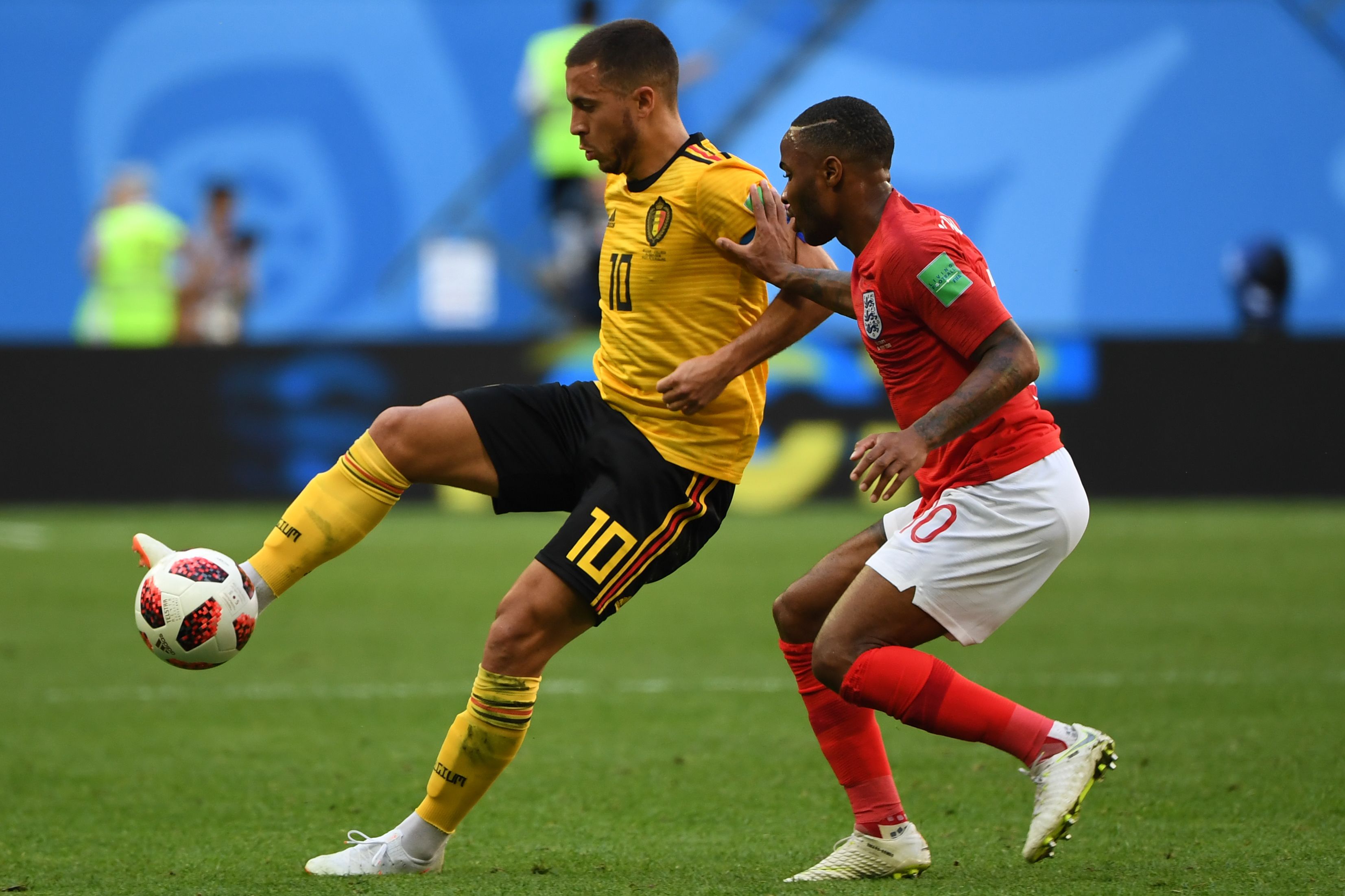 Belgium's forward Eden Hazard (L) fights for the ball with England's forward Raheem Sterling during their Russia 2018 World Cup play-off for third place football match between Belgium and England at the Saint Petersburg Stadium in Saint Petersburg on July 14, 2018. (Photo by Paul ELLIS / AFP) / RESTRICTED TO EDITORIAL USE - NO MOBILE PUSH ALERTS/DOWNLOADS (Photo credit should read PAUL ELLIS/AFP/Getty Images)