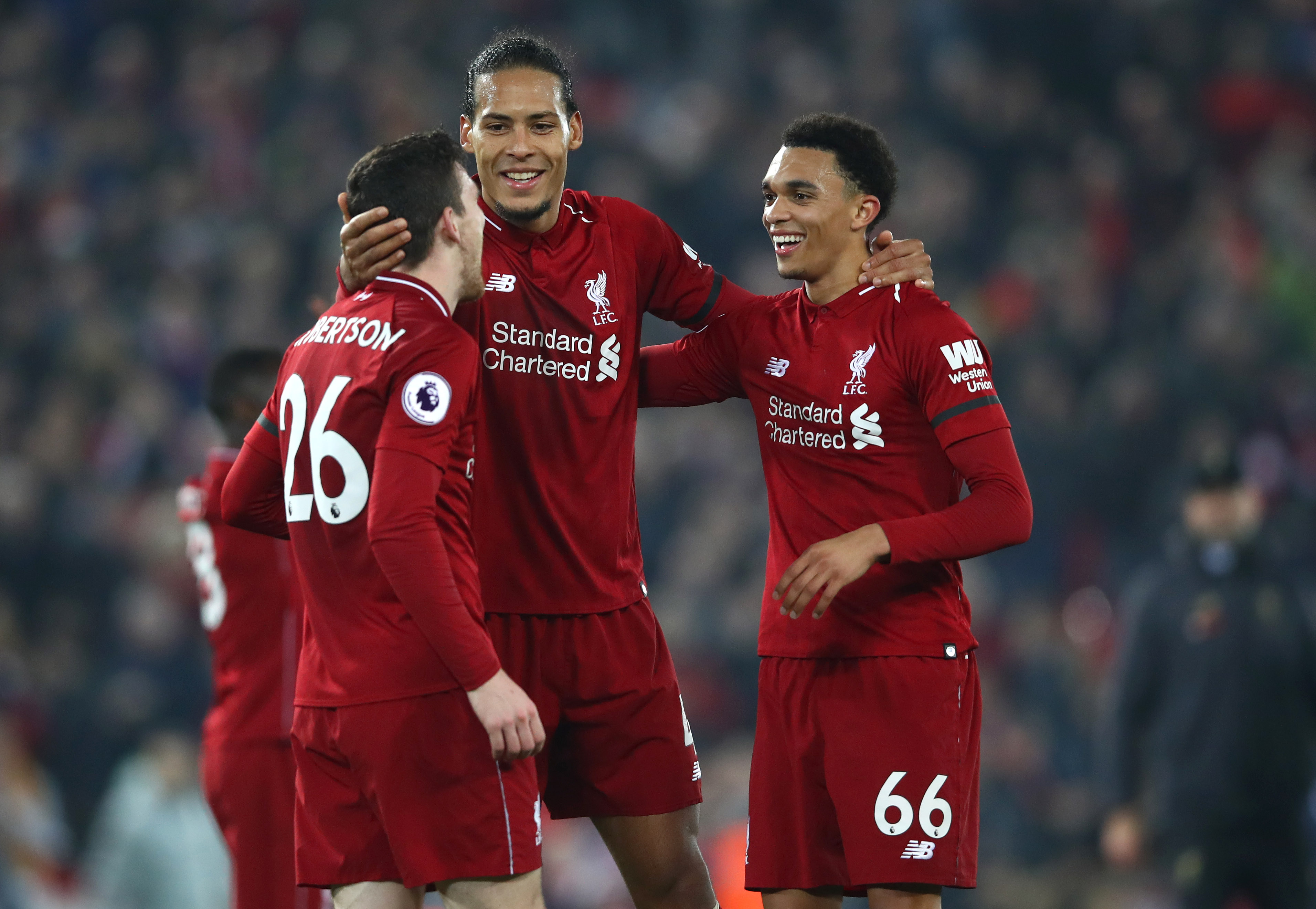 LIVERPOOL, ENGLAND - FEBRUARY 27: Virgil van Dijk of Liverpool celebrates victory with Trent Alexander-Arnold of Liverpool and Andy Robertson of Liverpool after the Premier League match between Liverpool FC and Watford FC at Anfield on February 27, 2019 in Liverpool, United Kingdom. (Photo by Clive Brunskill/Getty Images)