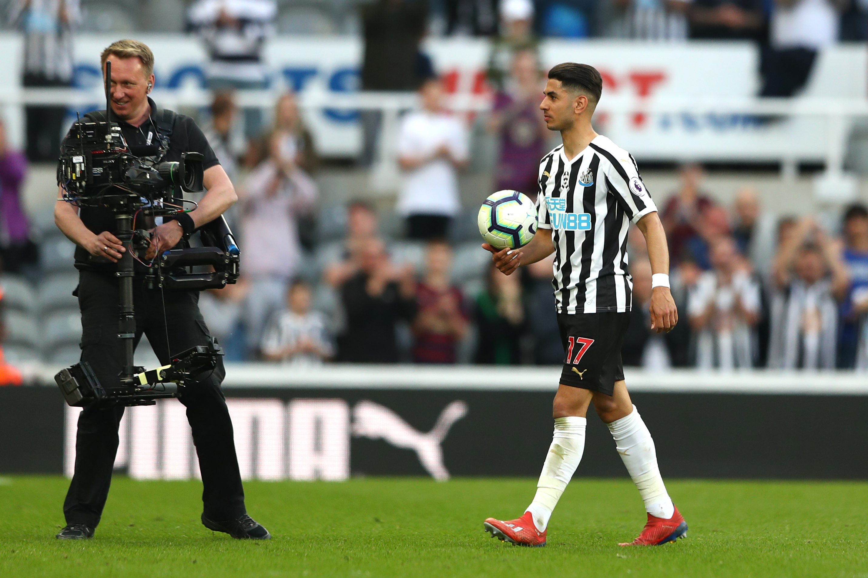 NEWCASTLE UPON TYNE, ENGLAND - APRIL 20: Ayoze Perez of Newcastle United leaves the pitch with the match ball following his hat-trick during the Premier League match between Newcastle United and Southampton FC at St. James Park on April 20, 2019 in Newcastle upon Tyne, United Kingdom. (Photo by Matthew Lewis/Getty Images)