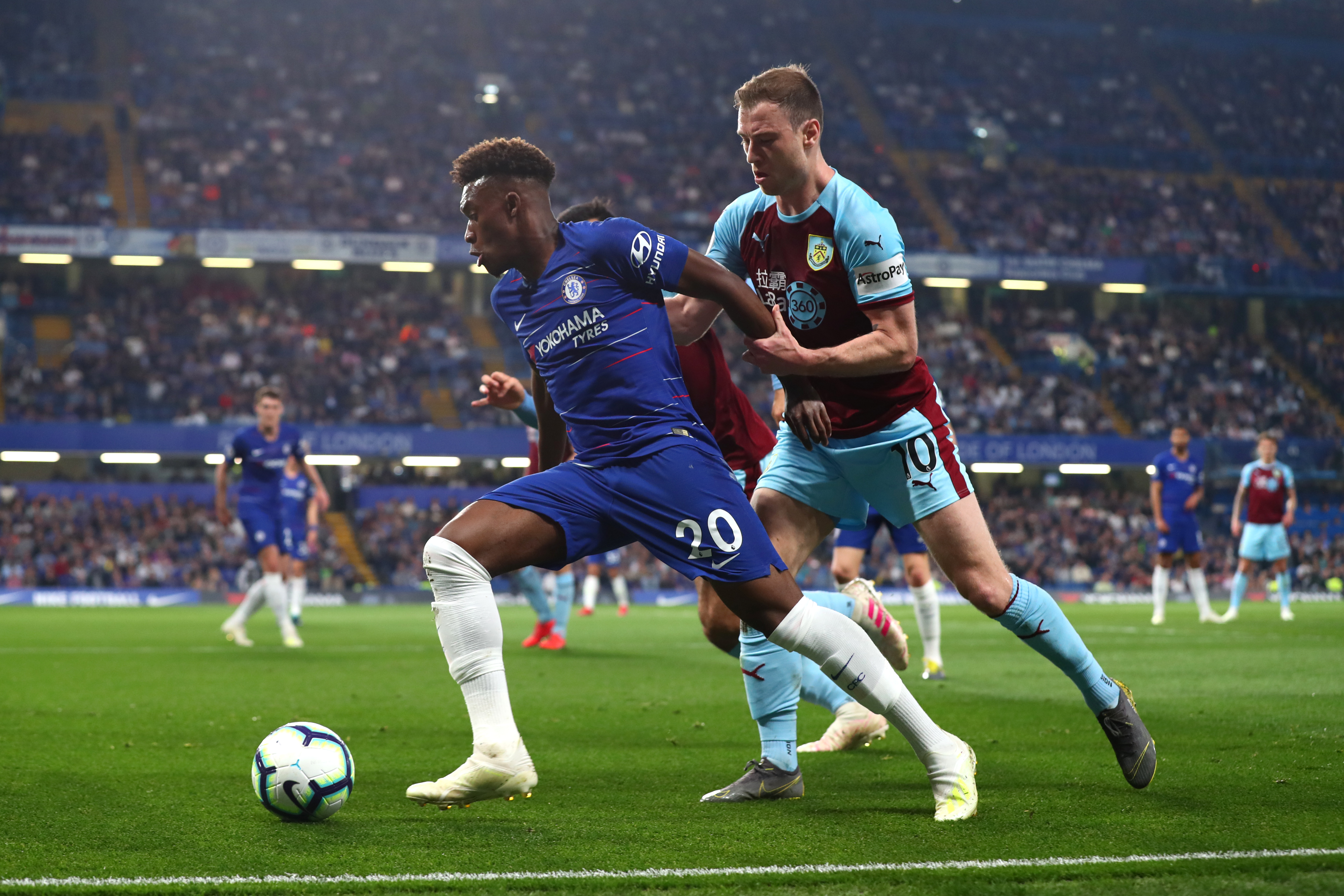 LONDON, ENGLAND - APRIL 22: Callum Hudson-Odoi of Chelsea holds off Ashley Barnes of Burnley during the Premier League match between Chelsea FC and Burnley FC at Stamford Bridge on April 22, 2019 in London, United Kingdom. (Photo by Clive Rose/Getty Images)