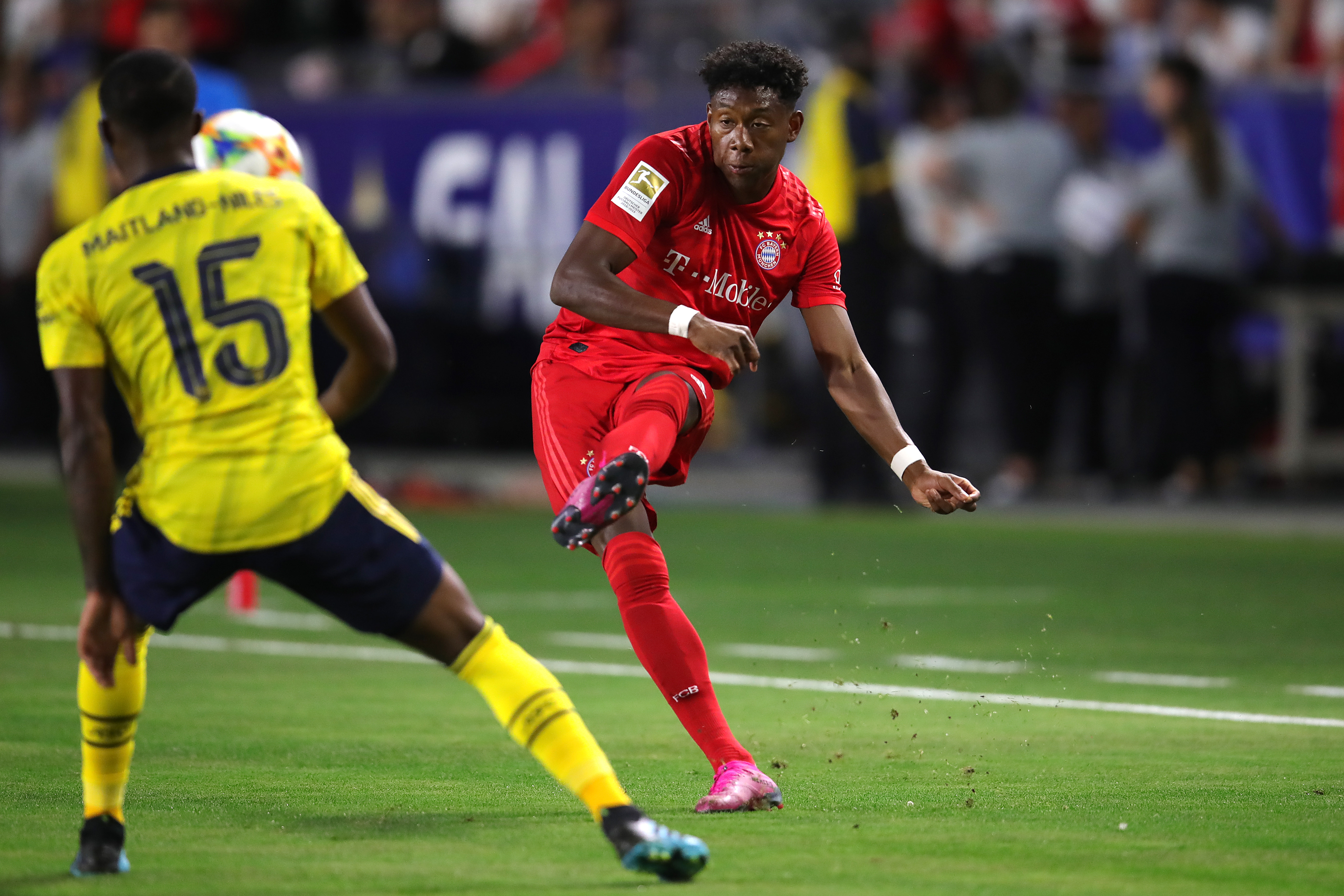 CARSON, CALIFORNIA - JULY 17: David Alaba of Bayern Muenchen battles for the ball with Ainsley Maitland-Niles of Arsenal London during the 2019 International Champions Cup match between Arsenal London and FC Bayern Muenchen at Dignity Health Sports Park on July 17, 2019 in Carson, California. (Photo by Alexander Hassenstein/Bongarts/Getty Images)