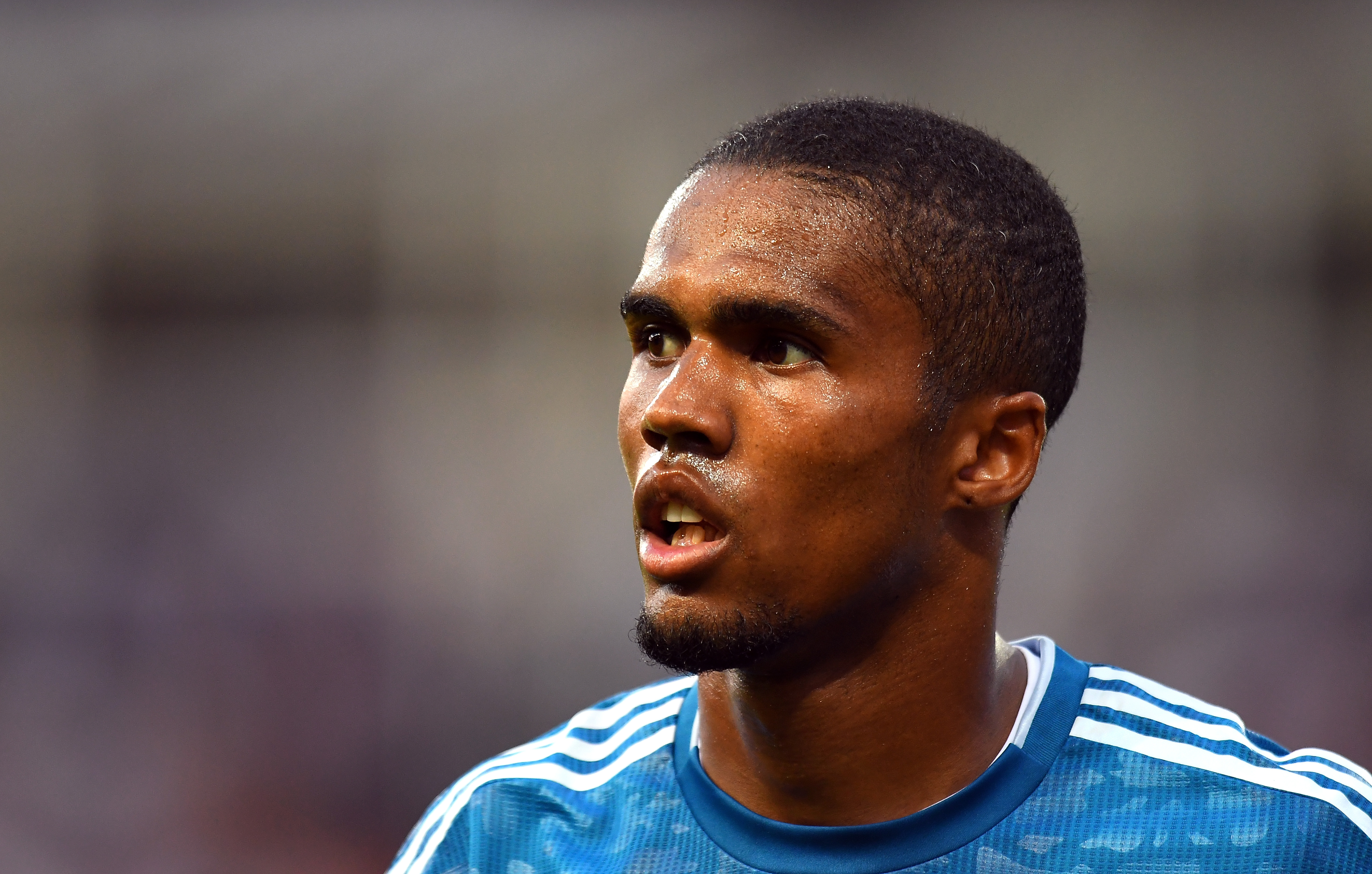PARMA, ITALY - AUGUST 24: Douglas Costa of Juventus  looks on during the Serie A match between Parma Calcio and Juventus at Stadio Ennio Tardini on August 24, 2019 in Parma, Italy.  (Photo by Alessandro Sabattini/Getty Images)