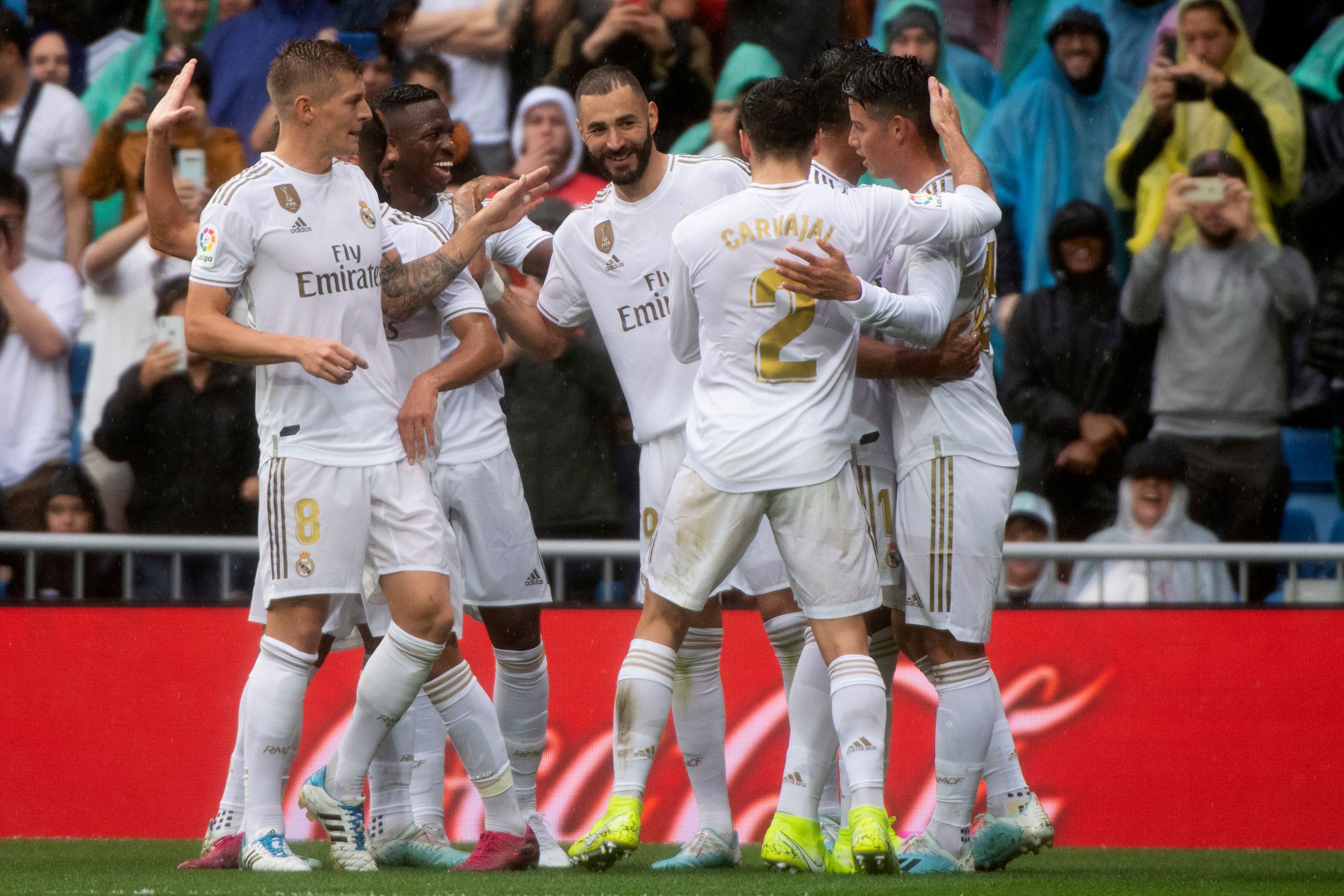 Real Madrid's French forward Karim Benzema (C) celebrates with teammates after scoring during the Spanish league football match Real Madrid CF against Levante UD at the Santiago Bernabeu stadium in Madrid on September 14, 2019. (Photo by CURTO DE LA TORRE / AFP) (Photo credit should read CURTO DE LA TORRE/AFP/Getty Images)