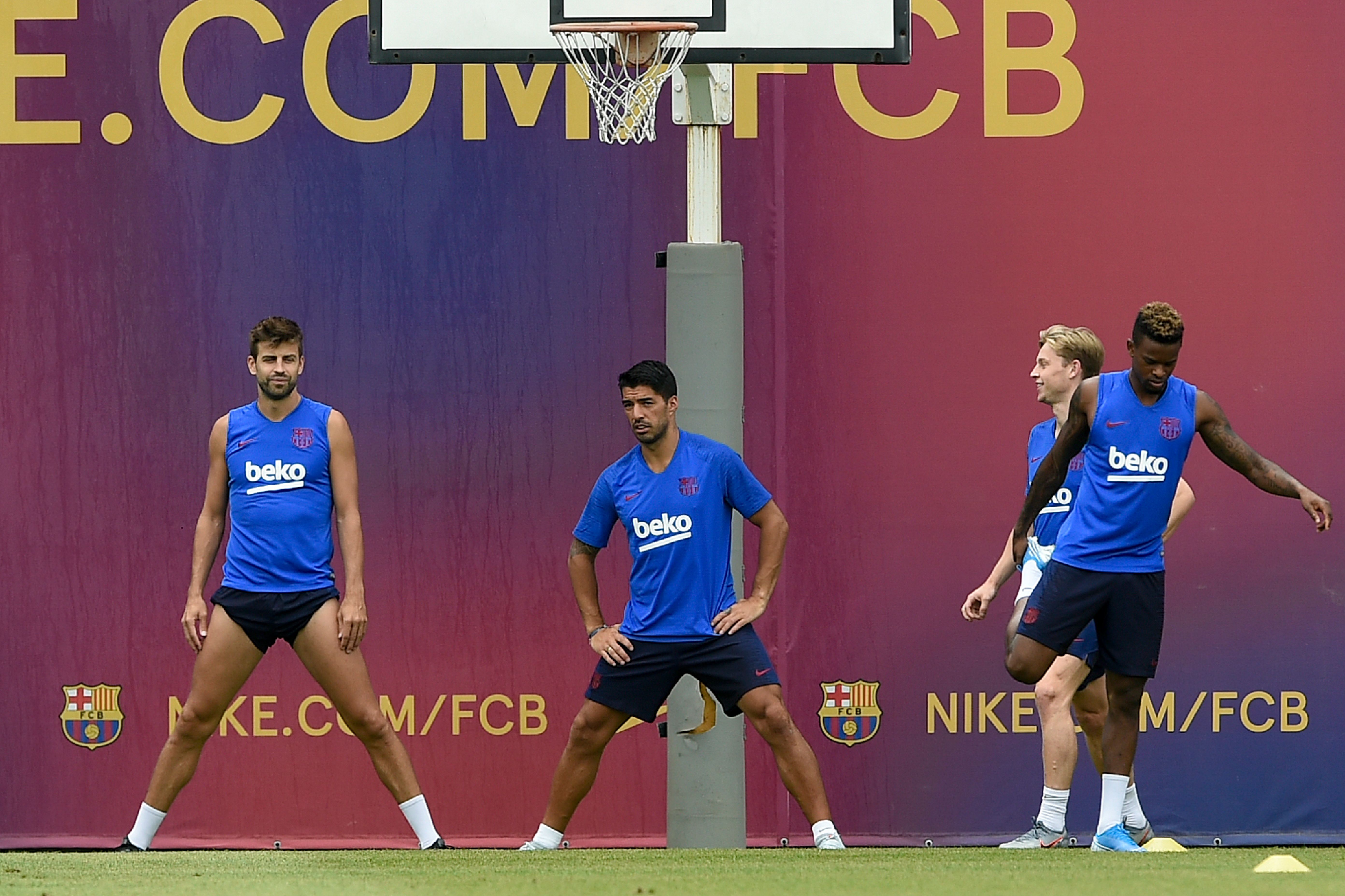 (FromL) Barcelona's Spanish defender Gerard Pique, Barcelona's Uruguayan forward Luis Suarez, Barcelona's Dutch midfielder Frenkie de Jong and Barcelona's Portuguese defender Nelson Semedo take part in a pre-season training session at the Joan Gamper training ground in Sant Joan Despi near Barcelona on July 31, 2019. (Photo by Josep LAGO / AFP)        (Photo credit should read JOSEP LAGO/AFP/Getty Images)