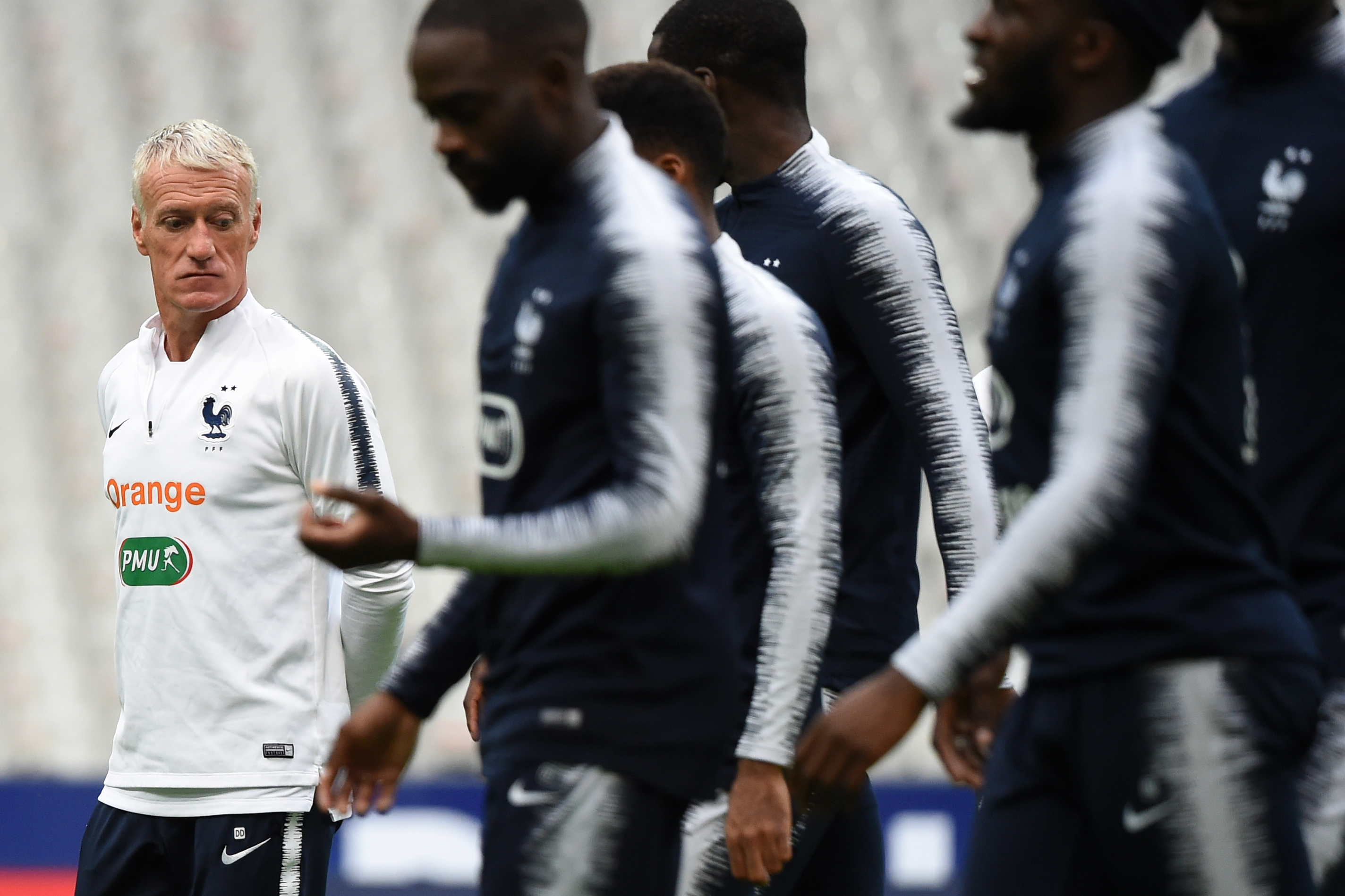 France's head coach Didier Deschamps (L) looks on during a training session at the Stade de France in Saint-Denis, northern Paris on October 13, 2019, on the eve of the Euro 2020 Group H qualification football match between France and Turkey. (Photo by Lucas Barioulet / AFP) (Photo by LUCAS BARIOULET/AFP via Getty Images)
