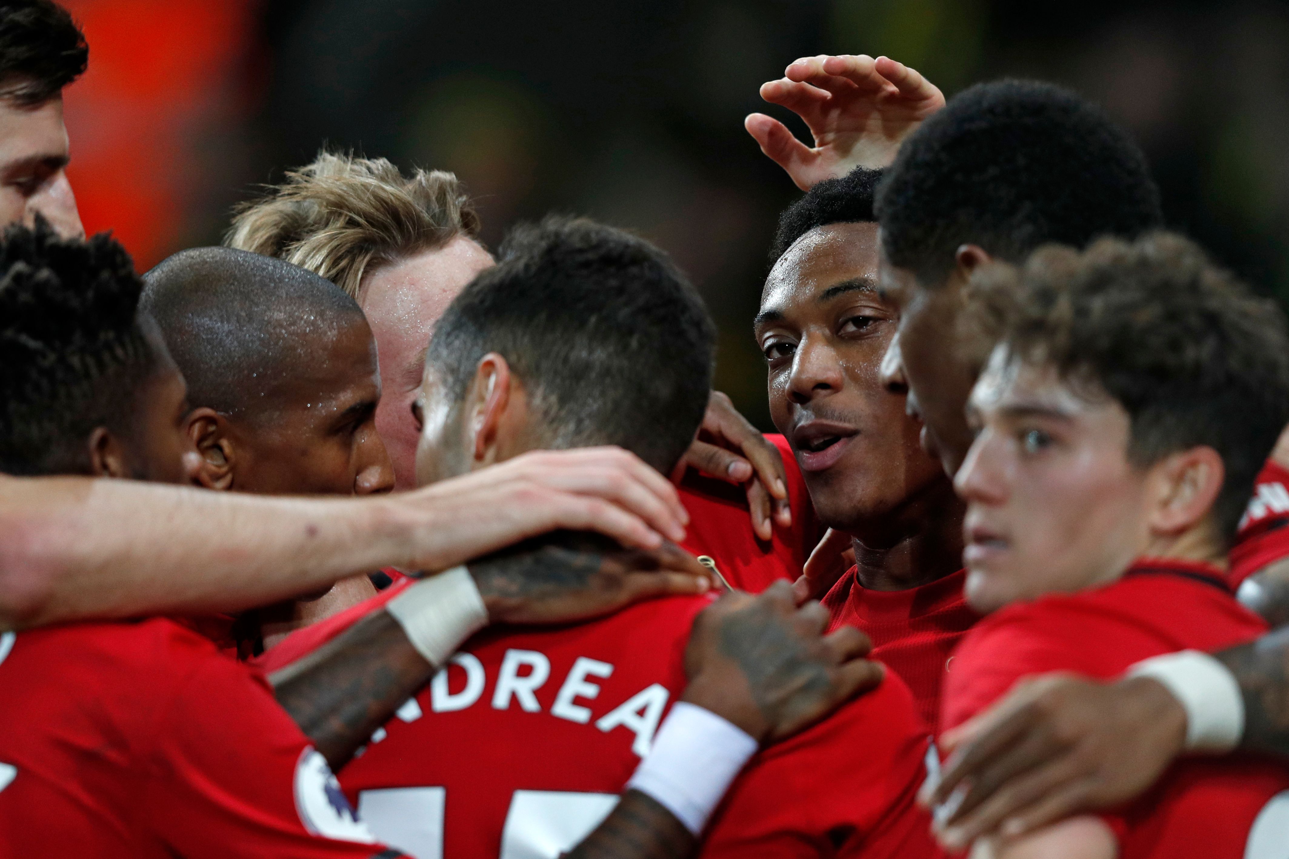 Manchester United's French striker Anthony Martial (C) celebrates with teammates after scoring their third goal during the English Premier League football match between Norwich City and Manchester United at Carrow Road in Norwich, eastern England on October 27, 2019. (Photo by Adrian DENNIS / AFP) / RESTRICTED TO EDITORIAL USE. No use with unauthorized audio, video, data, fixture lists, club/league logos or 'live' services. Online in-match use limited to 120 images. An additional 40 images may be used in extra time. No video emulation. Social media in-match use limited to 120 images. An additional 40 images may be used in extra time. No use in betting publications, games or single club/league/player publications. / (Photo by ADRIAN DENNIS/AFP via Getty Images)