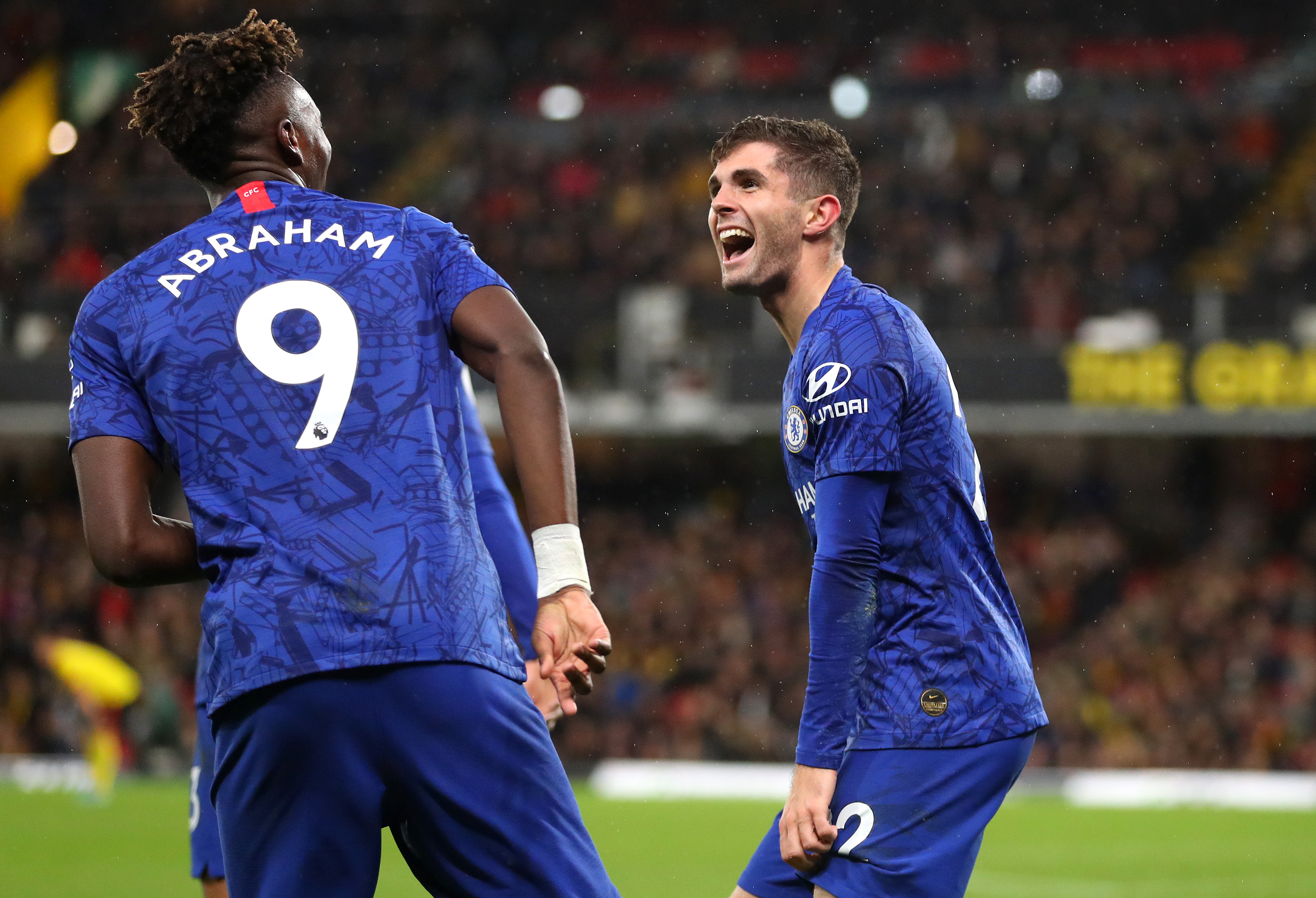 WATFORD, ENGLAND - NOVEMBER 02: Christian Pulisic of Chelsea celebrates with teammate Tammy Abraham after scoring his team's second goal during the Premier League match between Watford FC and Chelsea FC at Vicarage Road on November 02, 2019 in Watford, United Kingdom. (Photo by Catherine Ivill/Getty Images)